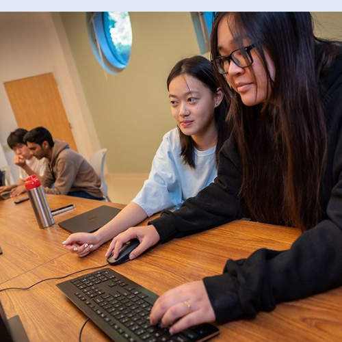 Two students in UC San Diego computer science course CSE 8 use the AI tutor prototype outside of class to study and do homework.